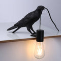 Raven table lamp in resin