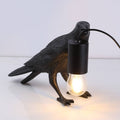 Raven table lamp in resin