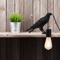 Raven table lamp in resin