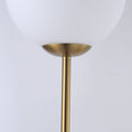 Lampadaire globe en verre et métal doré