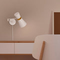 Plug-in swing arm wall sconce
