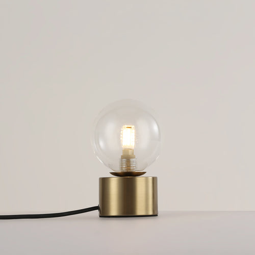 Table lamp with glass sphere