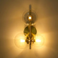 Wall light with glass spheres