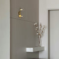 Wall light with glass spheres
