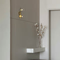 Wall light with glass spheres