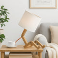 Articulated wooden table lamp