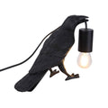Raven table lamp in resin 