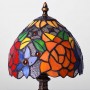 Lampada di ispirazione Tiffany con decorazione in vetro e base in metallo
